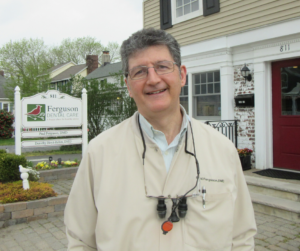 Dr. Ferguson in front of office